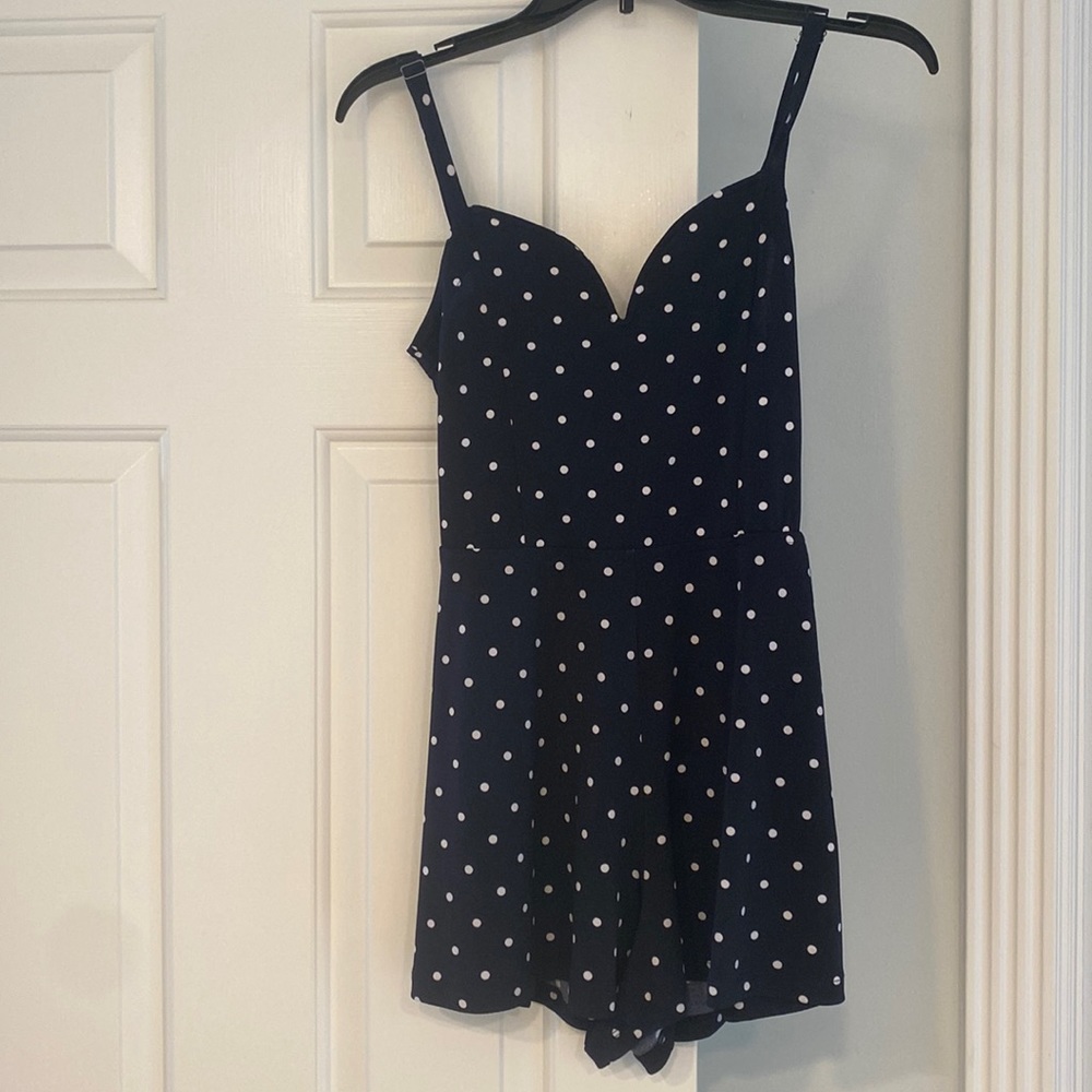 Navy and white polka dotted romper. From brand “Aeropostale”, size medium.